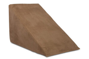 A bed wedge in brown that helps raise the top half of your body while you sleep